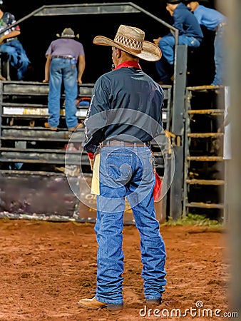 Itaja, Goias, Brazil - 04 22 2023: Person at a bull riding event in a rodeo arena Editorial Stock Photo