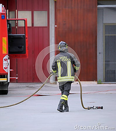 Italia, IT, Italy - May 10, 2018: Italian firefighter with unifiorm and text Vigili del fuoco that means Firemen in Italian Editorial Stock Photo