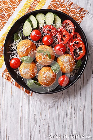 Italian arancini rice balls with cheese. vertical top view Stock Photo