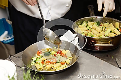 Italian chef prepares pasta Stock Photo