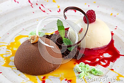 Italian Colorful ice cream scoops semifreddo with chocolate and raspberry Stock Photo