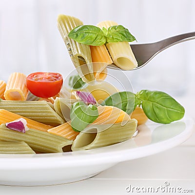 Italian cuisine eating colorful Penne Rigate noodles pasta meal Stock Photo