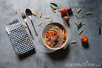 Italian delicacy pasta cooked in red sauce in a bowl. Stock Photo