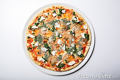 Italian delicious pizza with tomato, broccoli and cheese. Stock Photo