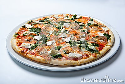 Italian delicious pizza with tomato, broccoli and cheese. Stock Photo