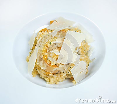 Italian dish risotto with wild white mushrooms and Parmesan cheese in a white plate Stock Photo