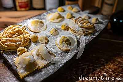 Italian food, fresh home made stuffed pasta tortelli or ravioli dumplings ready to cook, Parma, Emilia Romagna, Italy Stock Photo