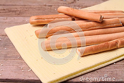 Italian food, Grissini bread sticks on wooden table. Stock Photo