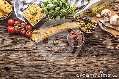 Italian food ingredients pasta olive oil parmesan cheese basil g Stock Photo