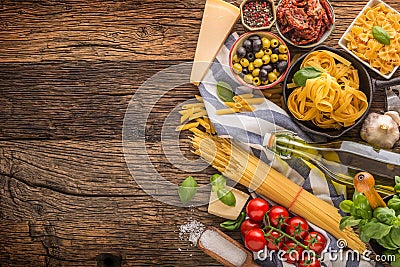 Italian food ingredients pasta olive oil parmesan cheese basil g Stock Photo