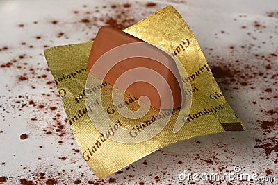 Turin, Piedmont/Italy -12/20/2018- Gianduiotto the traditional Piedmont chocolates with hazelnut. Editorial Stock Photo