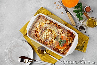 Italian food pumpkin lasagna with pumpkin instead of pasta leaves in the cooking dish. Stock Photo