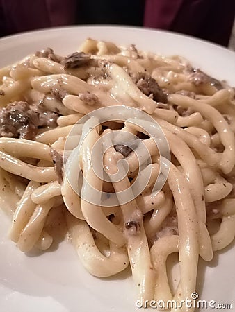 Italian food, typical product, evening time, dinner in the pub. Delicious! Pasta & tartufo. Stock Photo