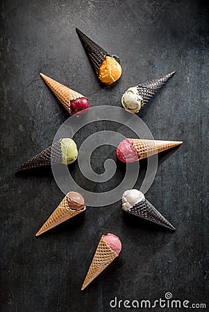 Italian gelato and sherbet in waffle cones on black background Stock Photo