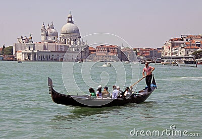 Italian gondolier and tourists Editorial Stock Photo