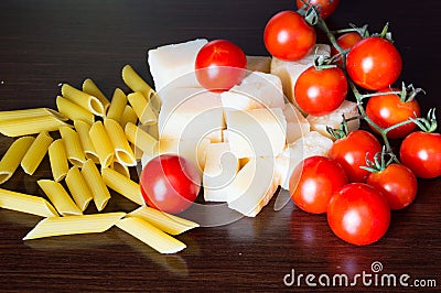 Italian grana padano, pasta and tomatoes Stock Photo