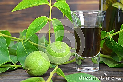 Green walnut liqueur Nocino Stock Photo