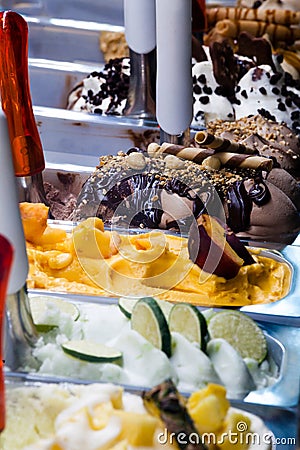 Italian ice cream. Trays with different flavors of Italian gelato. Containers with ice cream of different colors Stock Photo