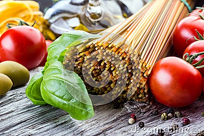 Italian and Mediterranean food ingredients on old wooden background. Stock Photo