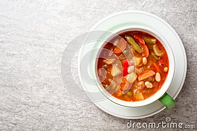 Italian minestrone soup in bowl on gray stone background Stock Photo