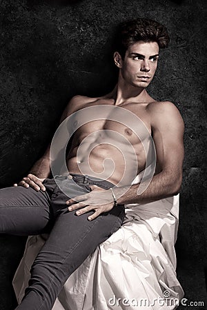 Italian model muscular man sitting. Shirtless portrait Stock Photo