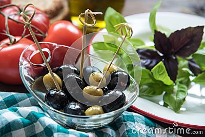 Italian olive tomatoes and basil Stock Photo