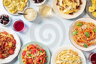 Italian pasta dishes forming a frame for copy space, overhead flat lay shot Stock Photo