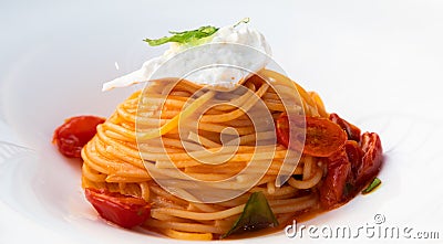 Italian pasta - spaghetti with burrata cheese closeup, mediterranean diet Stock Photo