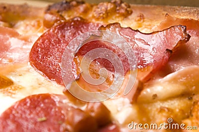 Italian pizza with bacon, salami and cheese Stock Photo