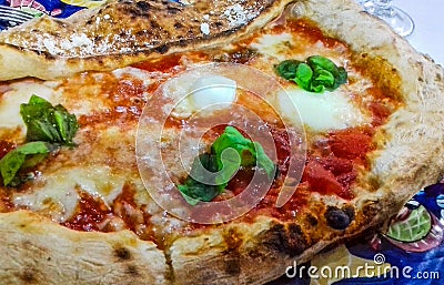 Italian pizza with mozzarella, basil and tomato Stock Photo
