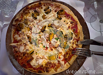 Italian pizza seafood on a plate Stock Photo