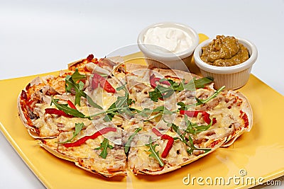 Italian pizza Tortilla with grated Mozzarella Stock Photo