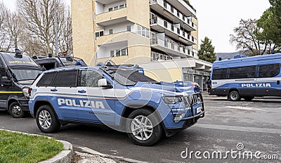 Italian police car in action in the streets of the city. Police car with riot protection. Jeep Grand Cherokee model car Editorial Stock Photo