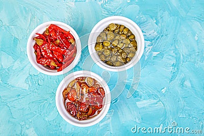 Italian preserved set - marinated capers and pepper, Sundried tomatoes Stock Photo
