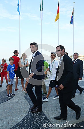 Italian Prime Minister Matteo Renzi attends Rio 2016 Olympics men`s road race at Copacabana Beach in Rio de Janeiro Editorial Stock Photo