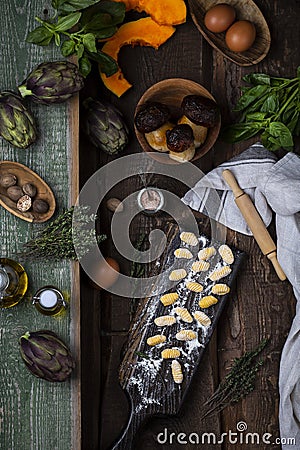 Pumpkin gnocchi uncooked on the wooden board Stock Photo