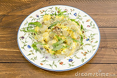 Italian recipe for ravioli stuffed with pear stew, serve with olive oil, California nuts Stock Photo