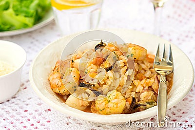 Italian rice dish risotto with seafood, shrimps and mussels Stock Photo