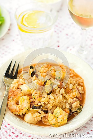 Italian rice dish risotto with seafood, shrimps and mussels Stock Photo