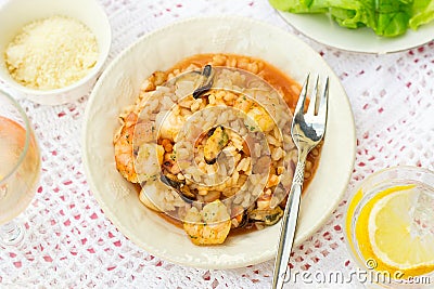 Italian rice dish risotto with seafood, shrimps and mussels Stock Photo