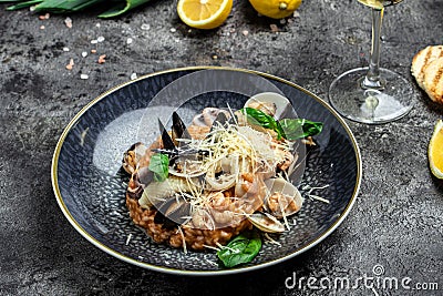 Italian risotto with shrimps, mussels, octopus, clams. Mediterranean cuisine. Restaurant menu, dieting, cookbook recipe Stock Photo