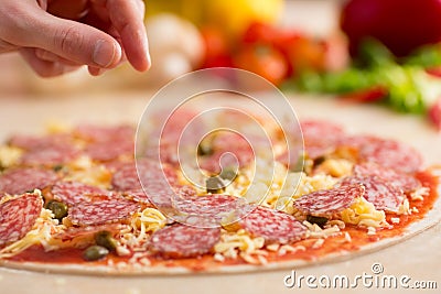 Italian salami pizza making Stock Photo