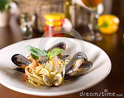 Italian spaghetti with mussels and basil Stock Photo