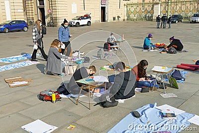 Italian students protest against the government`s choice to close schools by following remote lessons on the sidewalk Editorial Stock Photo