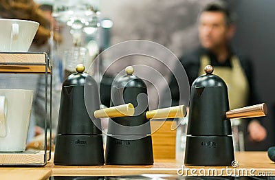 Italian style coffee maker with barman in the background Editorial Stock Photo