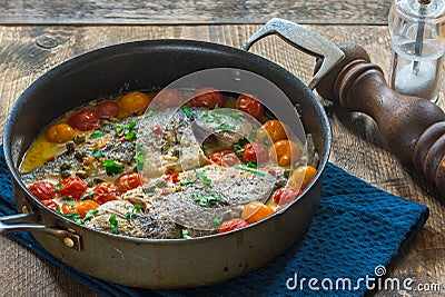 Italian style sea bream in crazy water - acqua pazza Stock Photo