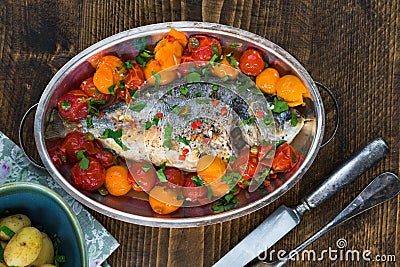 Italian style sea bream in crazy water - acqua pazza Stock Photo