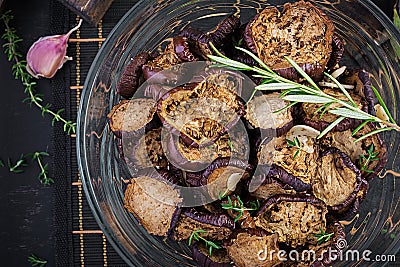 Italian sun-dried eggplant on a dark table. Preserved food. Stock Photo