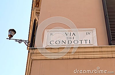 text of via CONDOTTI famous for the shops and the windows in Rom Stock Photo