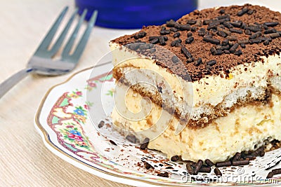 Italian Tiramisu cake macro with selective focus on edge. Stock Photo
